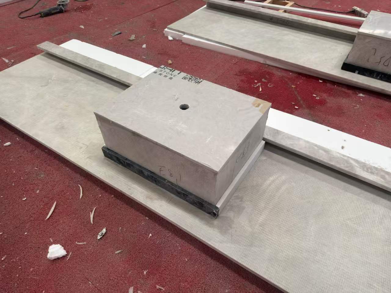 Rear view of a Taj Mahal Quartzite integrated sink countertop showing the assembled basin, underside support and reinforcement details. Rear view of a Taj Mahal Quartzite integrated sink countertop showing the assembled basin, underside support and reinforcement details.
